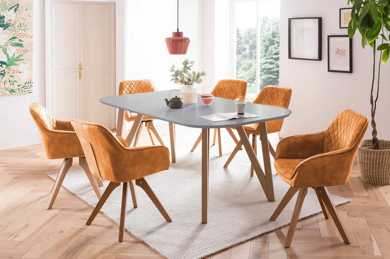 Essgruppe mit grauem Tisch und goldfarbenen Stühlen, Ansicht 1